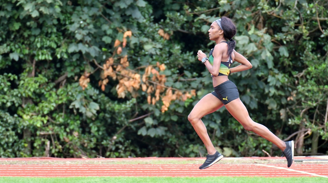 Natoya Goule running on a track