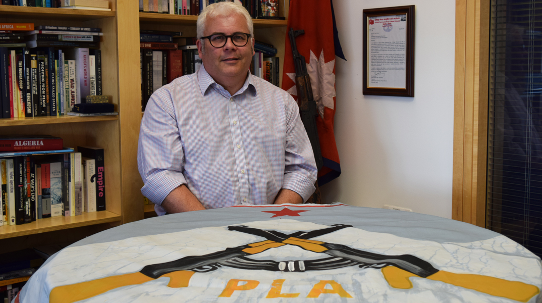 Professor Paul Jackson with a Maoist PLA flag