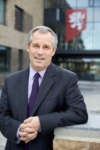 Mike Roden standing outside the University of Birmingham School