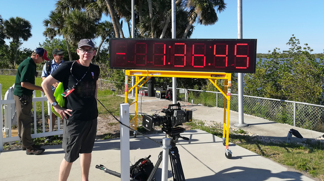 Professor Bill Chaplin beside the TESS launch countdown timer