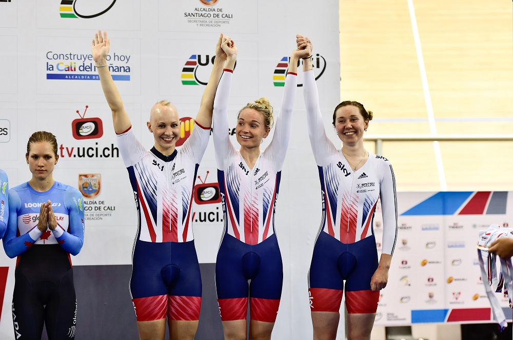 Ciara and teammates celebrating on a podium