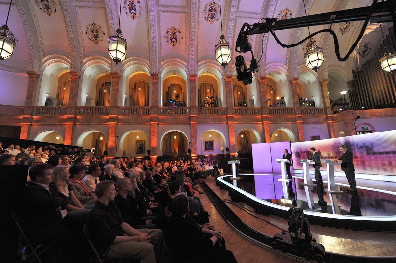 Three politicians in live TV debate in front of audience