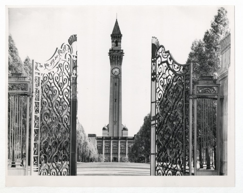 Black and white image of Old Joe clock tower from North Gate with the gate open