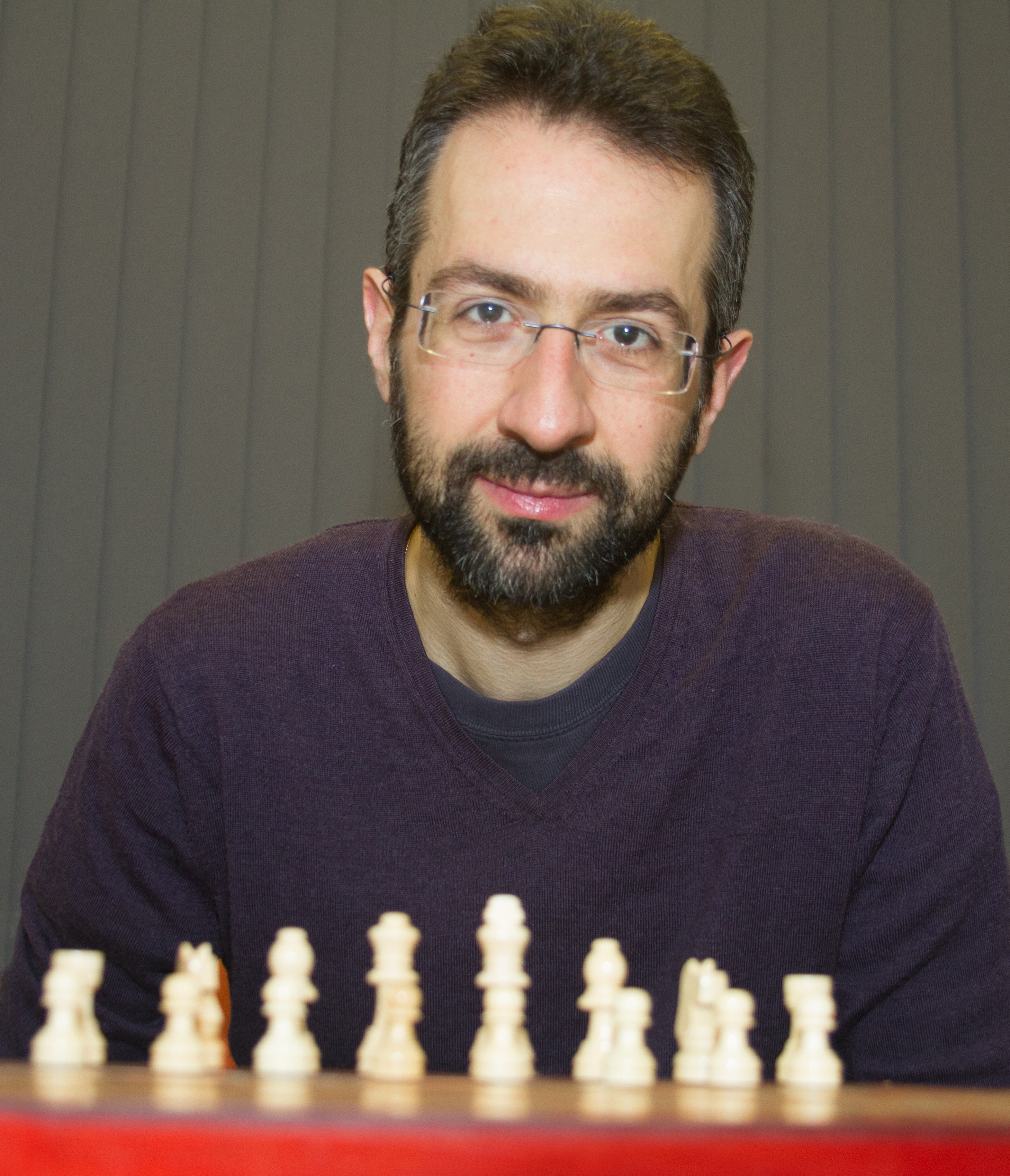 Dr Michalis Drouvelis at a chess board
