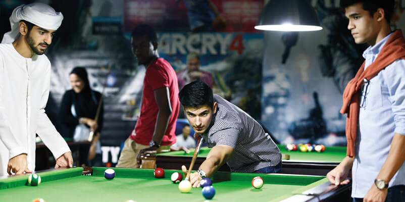 Students playing pool