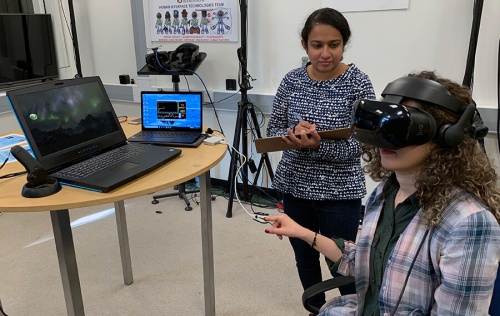 Elza Mathew and a student testing the VR project