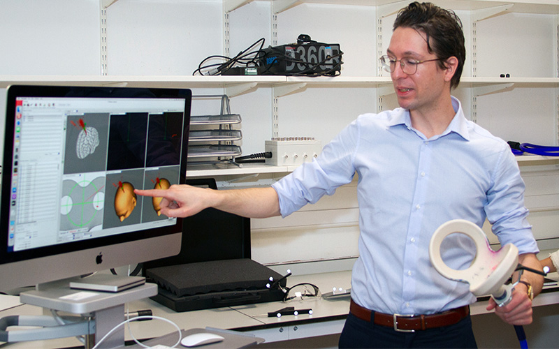 Scientist explaining results on computer monitor