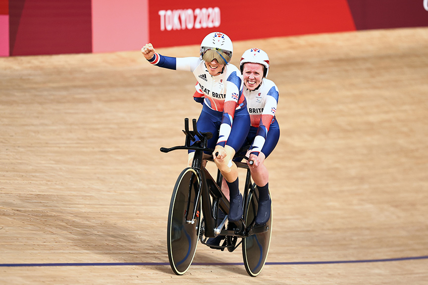 Paralympian cyclist Lora Fachie and guide Corrine Hall celebrate winning a gold medal