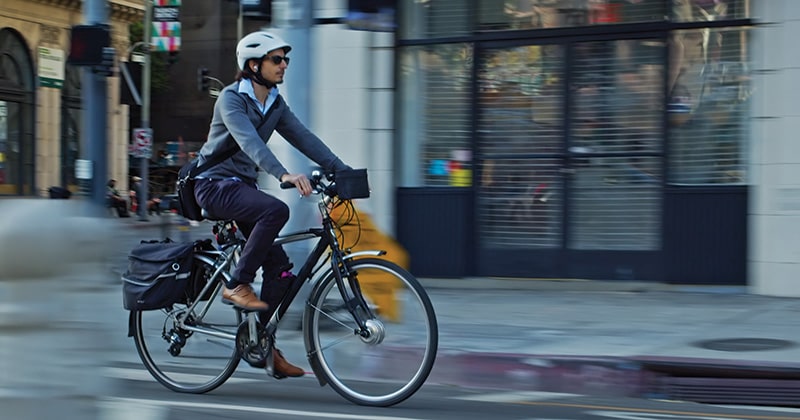 Man on bike in European city
