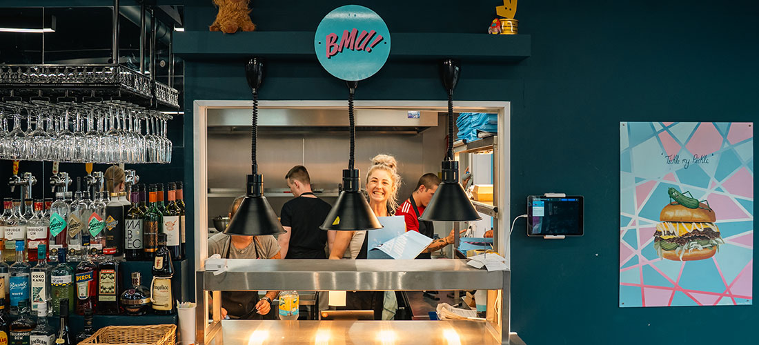 Molly working in the kitchen of Burger-Me-Up