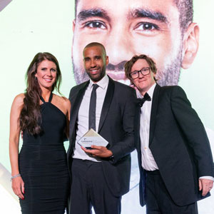 Grant Baker, centre, receiving award