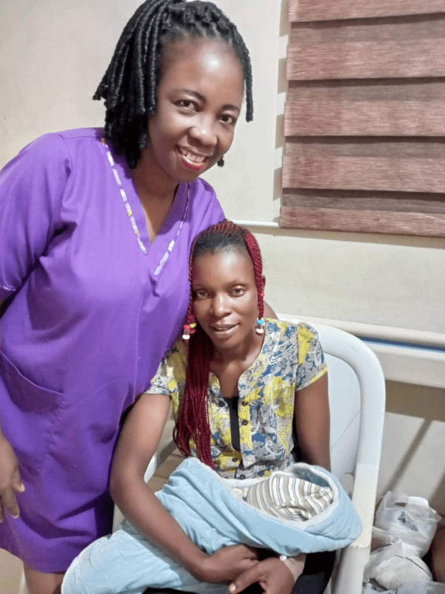 Midwife Zino Oneyeyone with a mother  and baby in Nigeria who were helped by  E-MOTIVE