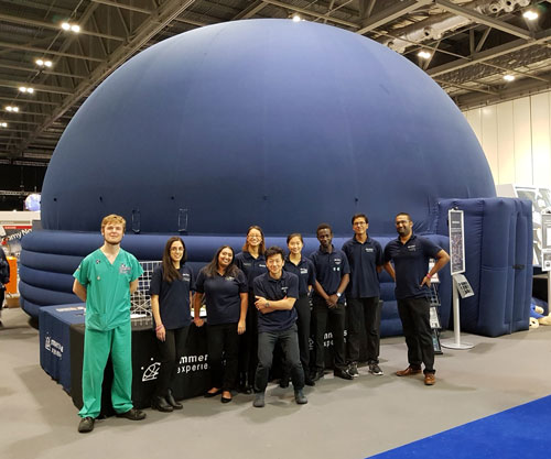 Zee Dinally (right) with team in front of immersive dome