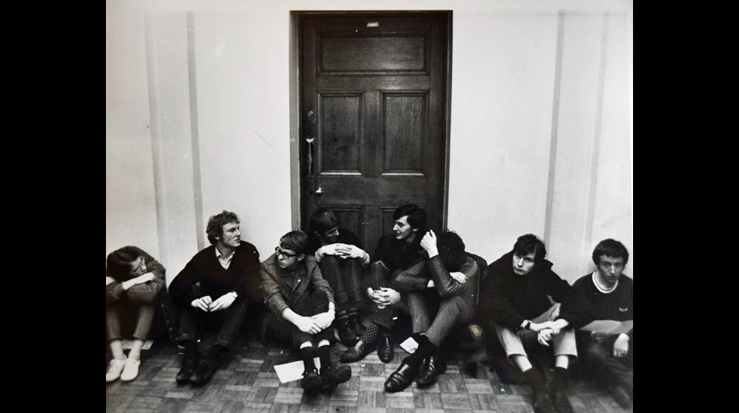 Students conduct a sit-down protest outside the Vice-Chancellor's office